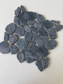 Black 11x11 natural stone pebble mosaic tile for wall installation by Roca, showcasing textured pebble pattern and earthy tones.