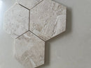 Diana polished hexagon marble tile used as a kitchen backsplash