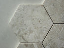 Diana marble hexagon mosaic tile installed on a luxury bathroom floor