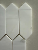 Dolomite picket honed marble mosaic installed as an elegant kitchen backsplash with soft matte finish