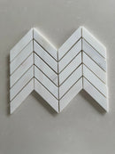 Dolomite polished 1x4 chevron marble mosaic tile featuring white marble and subtle gray veining