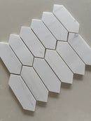 Close up of Dolomite honed marble picket mosaic showing natural veining and smooth matte surface texture