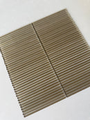 Lux Bronze 12x12 flutted glass mosaic wall tile by Roca, showcasing textured bronze tiles for modern interior design.