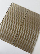 Lux Bronze 12x12 fluted glass mosaic wall tile by Roca, showcasing a textured bronze finish for modern backsplash designs.
