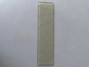 Champagne 3x12 glass tile used as an elegant kitchen backsplash
