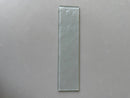 Close-up view of LUX Crystal 3x12 glass tile showing its reflective surface and linear format
