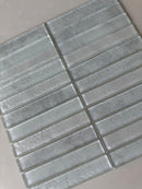 Roca Lux Harbor 12x12 stacked glass mosaic wall tile for backsplash with a glossy, textured blue and green pattern.