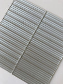 Roca Lux Sand 12x12 flutted glass mosaic tile for wall installation, featuring textured, sandy-colored glass surface.
