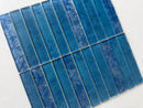 Sapphire 12x12 stacked mosaic wall tile by Roca featuring blue glass tiles for a modern backsplash design.