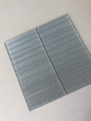 Roca Lux Smoke 12x12 Flutted Glass Mosaic Wall Tile showing smoky gray, textured glass tiles for backsplash or wall decor.