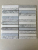 Blue Mix Carrara Thassos stacked mosaic installed on a sophisticated shower wall
