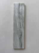 Polished green marble brick tile by Roca, natural stone 2x10 wall tile with elegant veining and glossy finish.