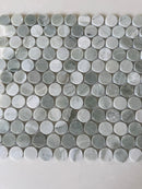 Natural stone tile mosaic featuring green mix penny round tiles from Roca, ideal for flooring and wall accents.