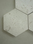 Shellstone Myra hexagon mosaic tile installed on a bathroom floor